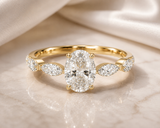 Oval Cut Diamond Ring with Marquise Side Stones